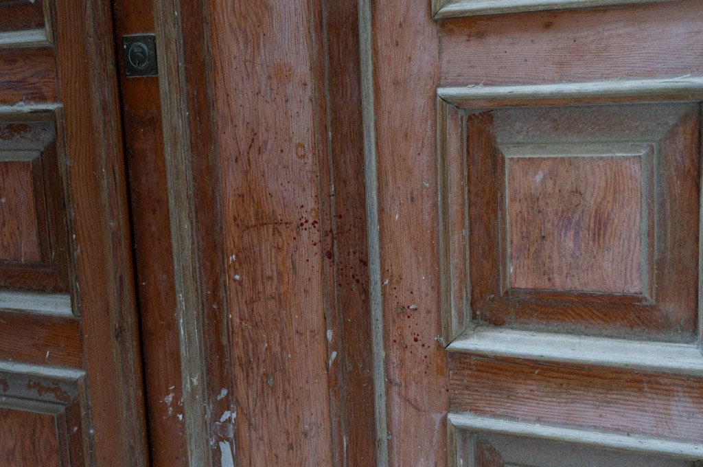 Blood on walls and doors during Riti Settennali in Guardia Sanframondi